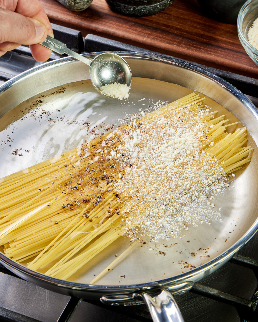 2. Add 2 tablespoons of the cheese mixture and ½ teaspoon each salt and coarsely ground black pepper. Pour in 4½ cups of room-temperature water.