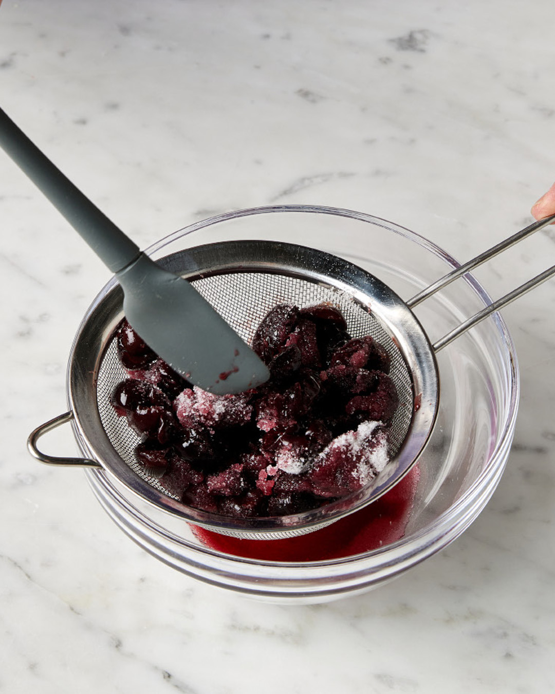 1. Place the pitted, halved cherries (thawed, if frozen) in a colander set in a bowl. Sprinkle with 2 tablespoons sugar, then toss to combine. Let stand at room temperature for 30 minutes.