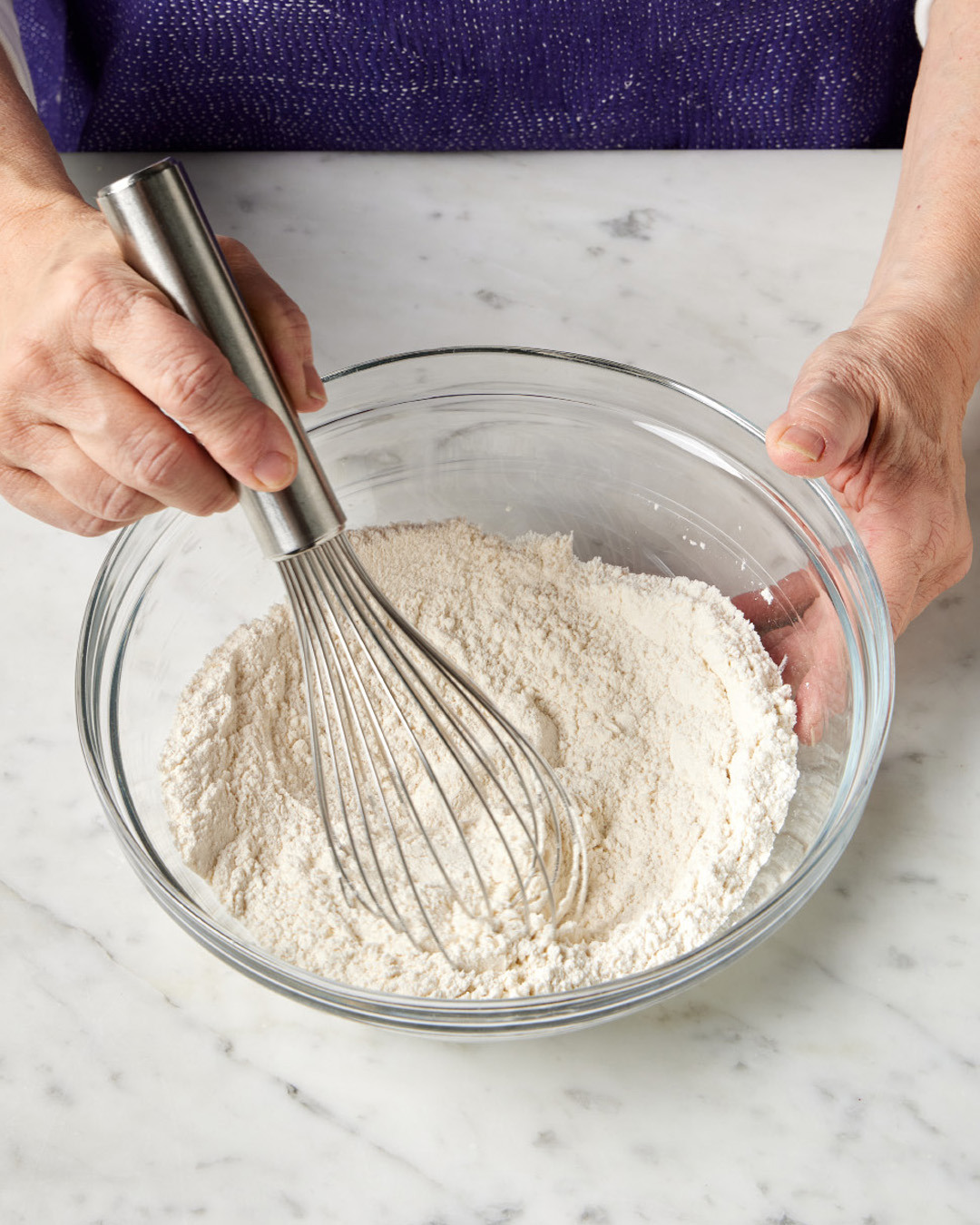 2. Microwave the milk and butter on high for 1 minute; stir the mixture to ensure the butter is fully melted. In a medium bowl, whisk together the flour, baking powder and salt.