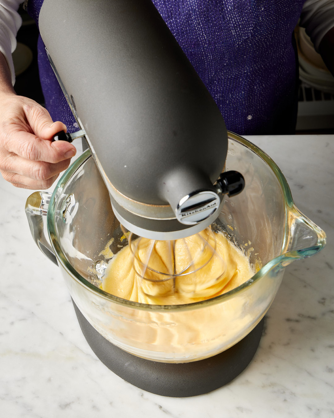 4. Increase to medium-high. Continue to beat until the mixture is pale yellow and doubled in volume, 2 to 3 minutes. Add the vanilla to the milk mixture, then reduce the mixer to low.