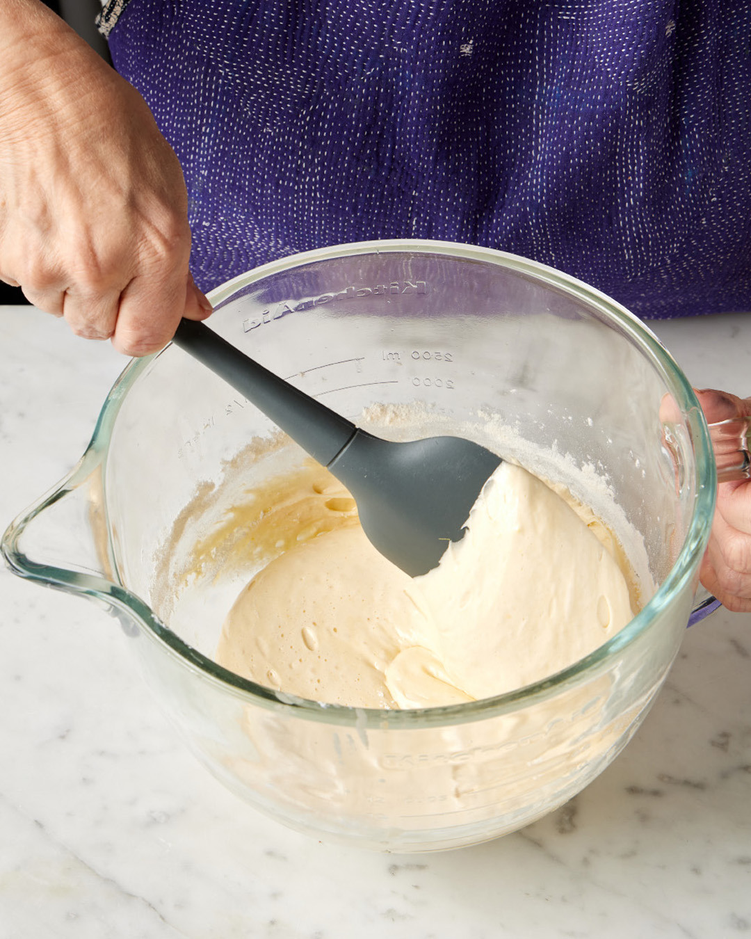 7. Using the spatula, give the batter a few folds, scraping the bottom and sides of the bowl to ensure no pockets of flour remain. Pour the batter into the prepared 9-inch springform pan.