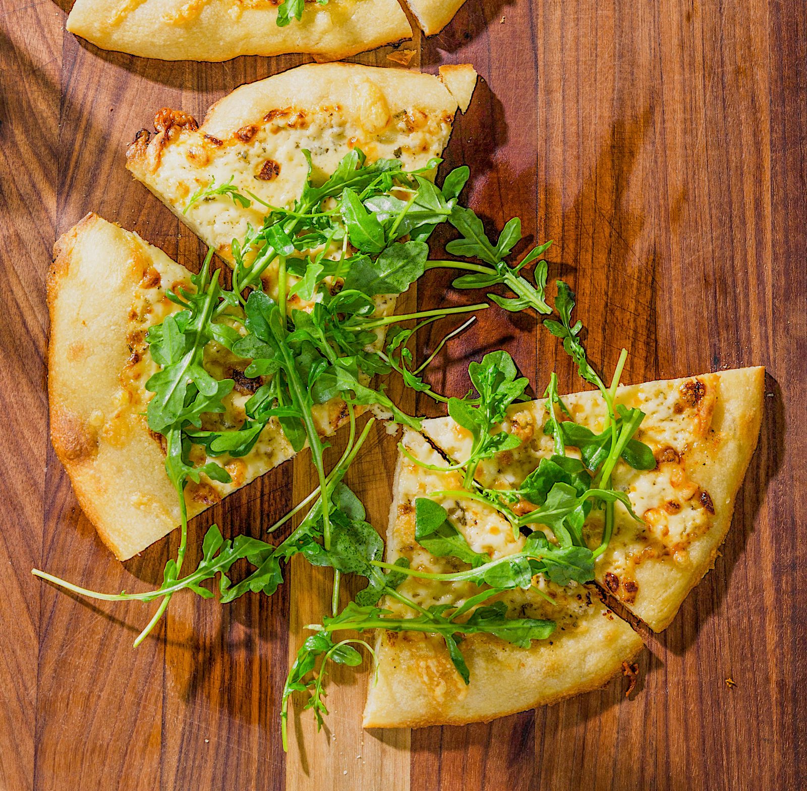 Pour in the Pan Pizza Parmesan Cream Fontina Arugula