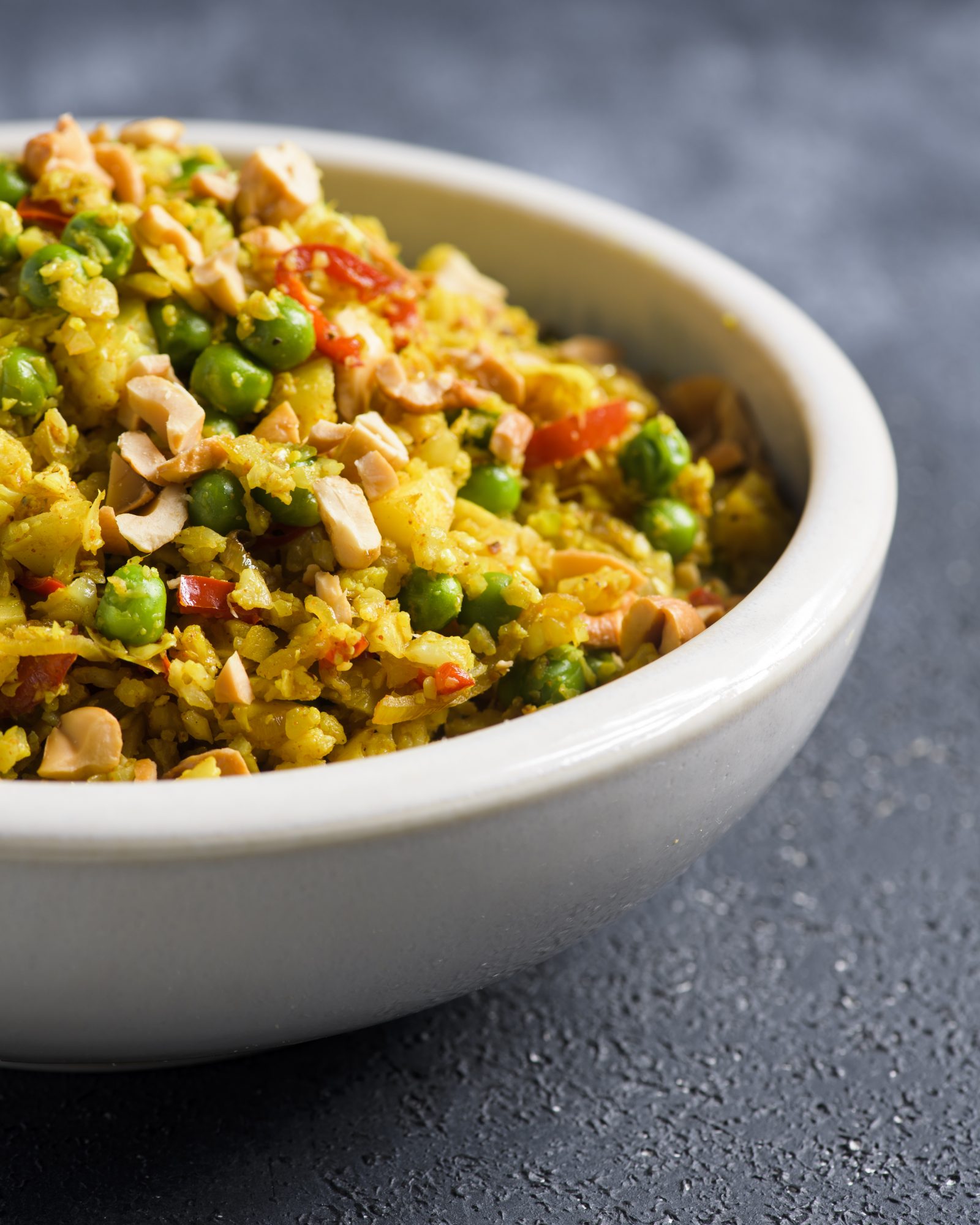 Curried cauliflower rice peas cashews v