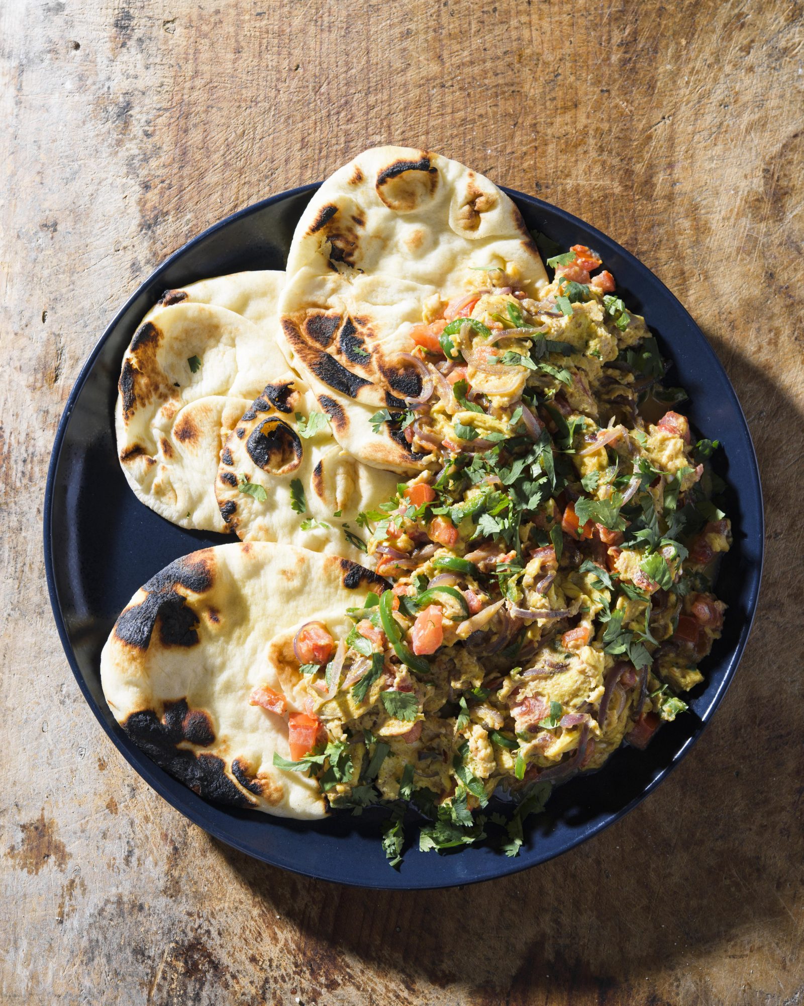 Indian style scrambled eggs tomatoes chilies v
