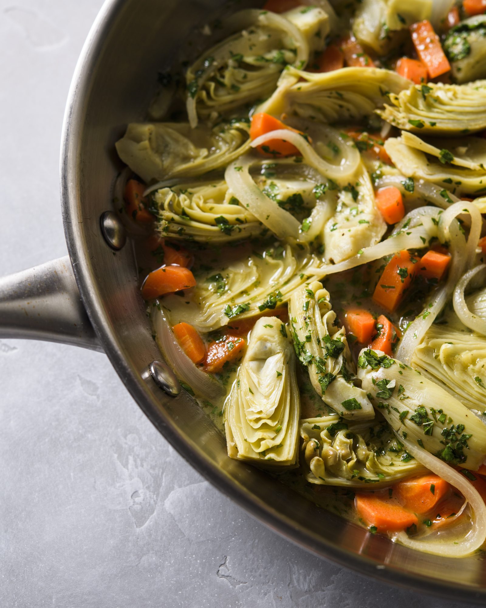 Lemony wine braised artichokes v