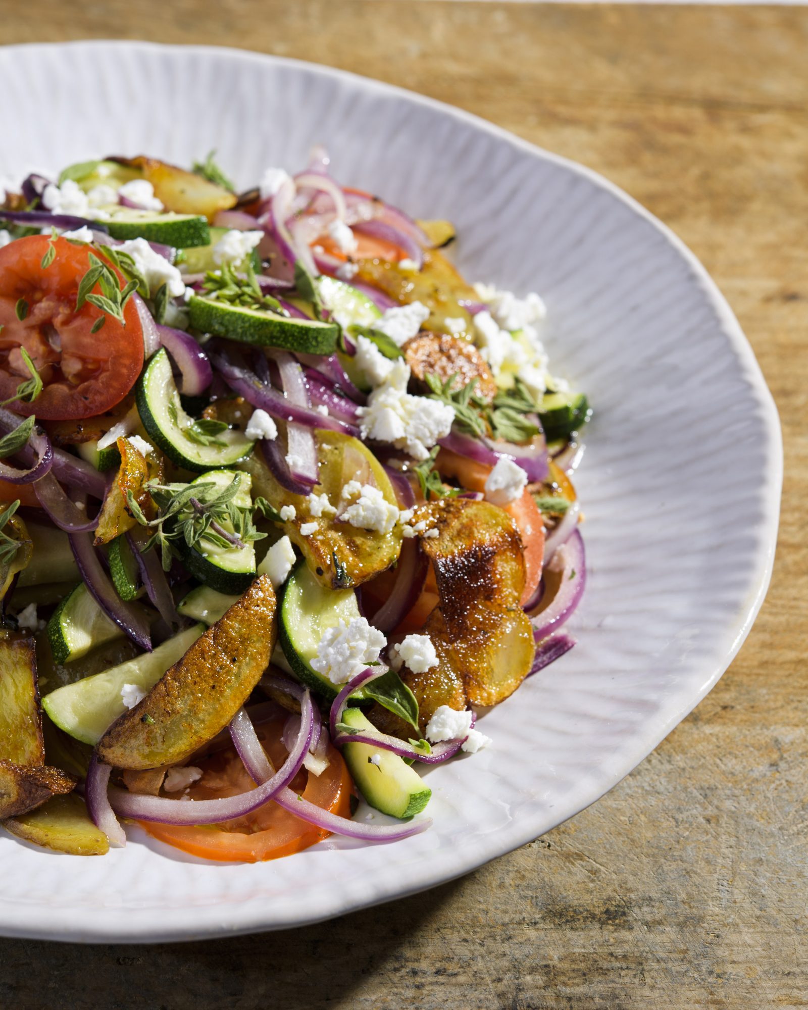 Roasted potatoes zucchini tomatoes feta v
