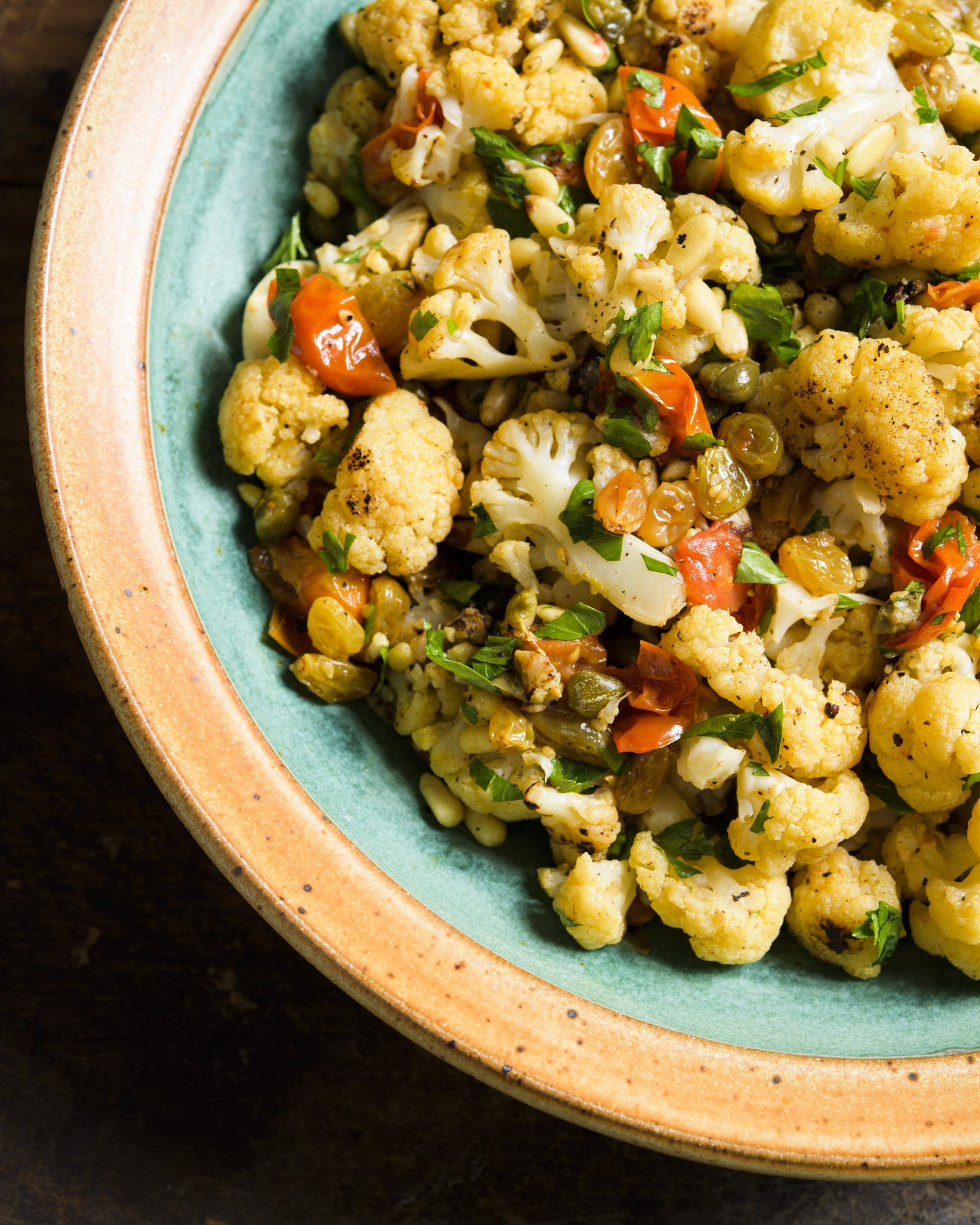 Smothered cauliflower with tomatoes capers and raisins vegetables v