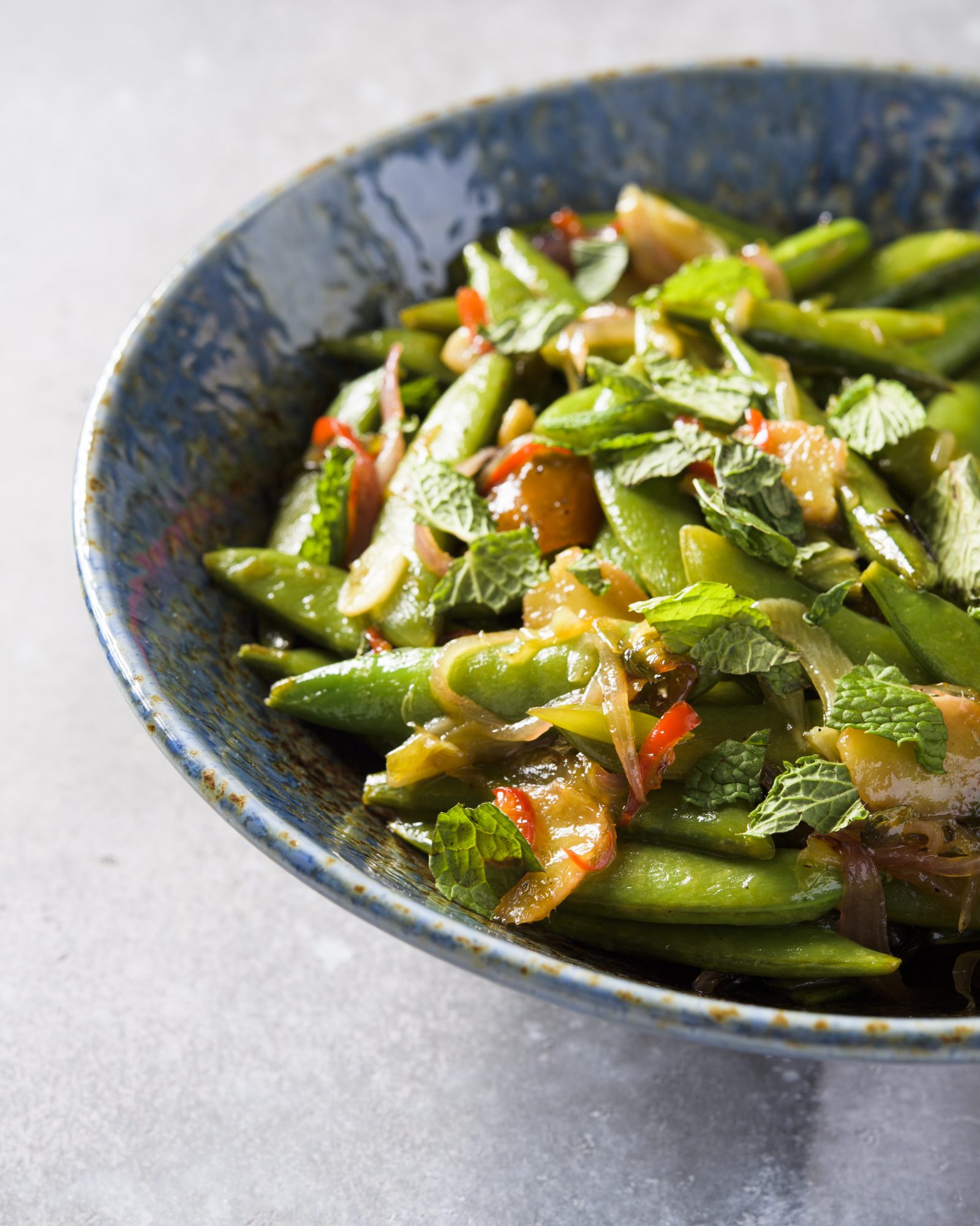 Stir fried snap peas scallions ginger mango chutney v