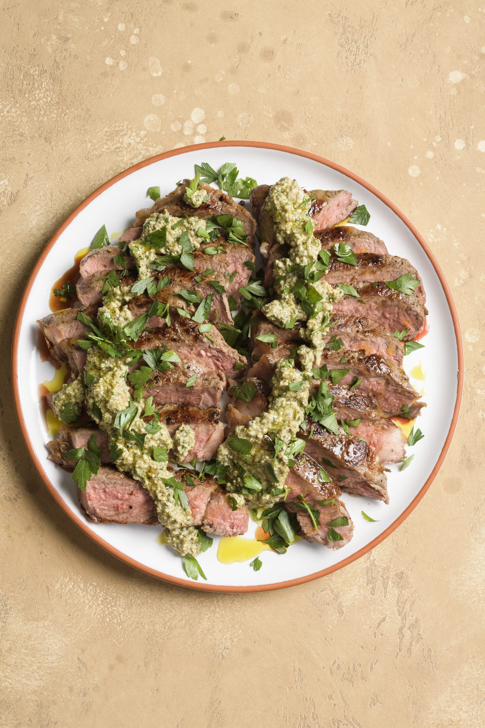 Strip steaks walnut parsley caper sauce