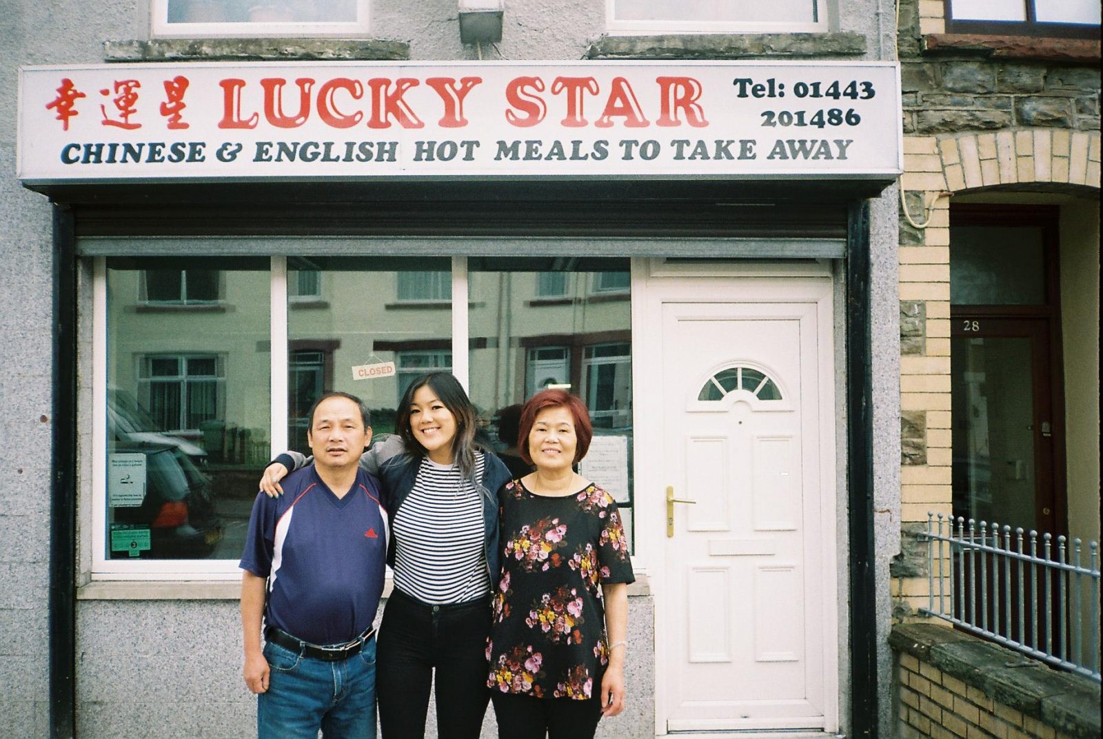 Angela and her parents outside the takeaway on the last day of service in 2018
