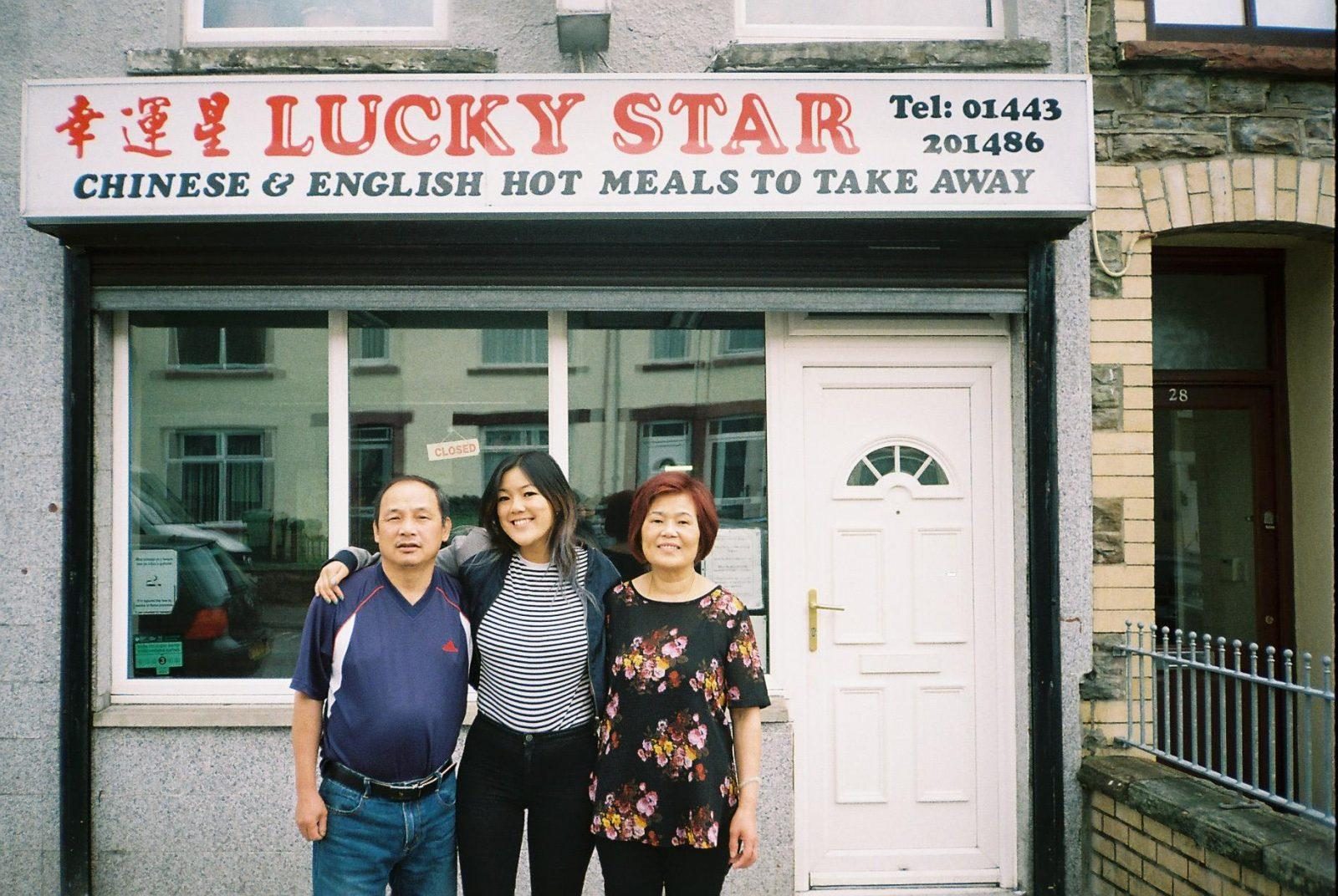 Angela and her parents outside the takeaway on the last day of service in 2018