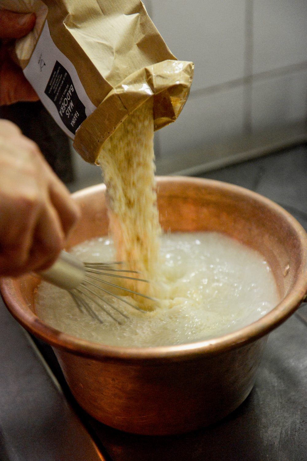 Creamy polenta creates the perfect foil for briny shrimp in a spicy-sweet tomato sauce.