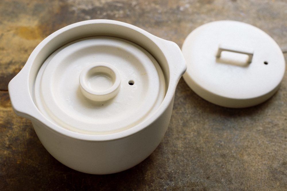 Ceramic rice cookers make fluffier, slightly sticky rice.