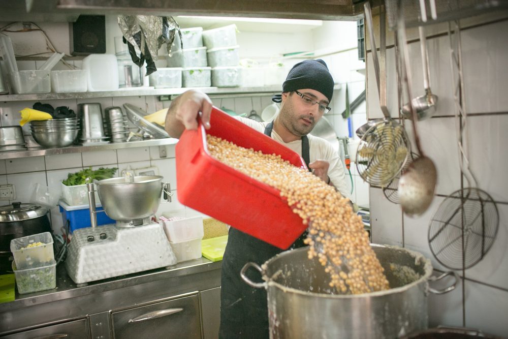 At Gargir Hasav, near Tel Aviv’s Levinsky Market, hummus is made fresh each morning, 5 liters at a time. To ensure a smooth, almost sour cream-like consistency, the chickpeas, still piping hot, are pureed for a full three minutes. I