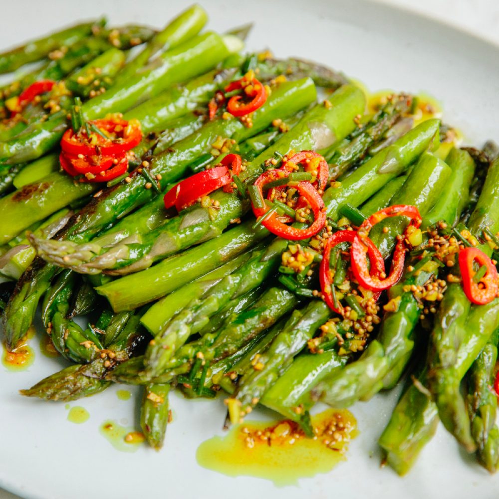 Pan roasted asparagus with spiceed oil and chives milk street