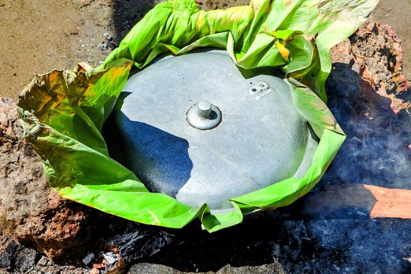 A banana leaf aids the steaming.