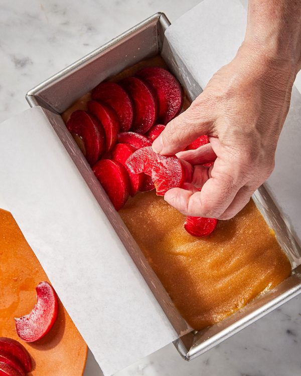 Plum cake slices layered over caramel