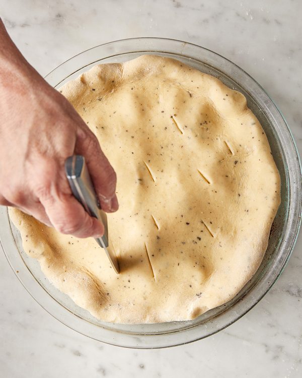 Tomato tart slits in dough and bake until bubbling